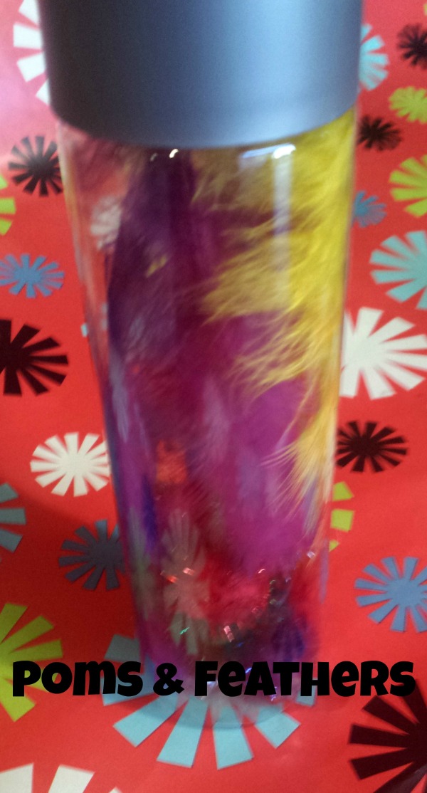 Poms and feathers sensory bottle