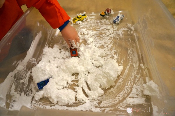 DIY Snow that is perfect for indoor sensory play.  I love how the DIY snow even feels cold when made.  Super fun sensory play experience!