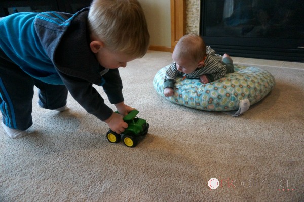 Toddler in Tummy Time Trucks