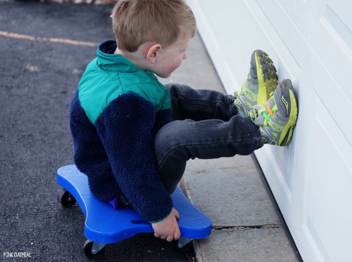 Using a scooter board to practice jumping is a fun way to work on this skill! A great jumping practice idea! 